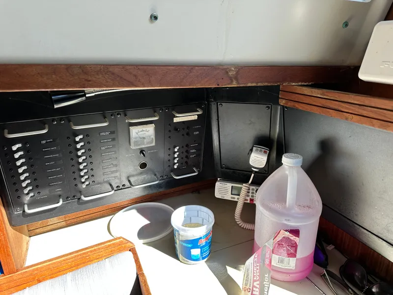 Slide: The Image of Electrical panel and equipment inside a 1989 C&C 30 sailboat cabin. - 31
