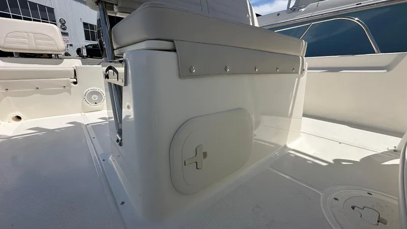 Slide: The Image of 2025 Boston Whaler 190 Montauk interior, featuring seating and storage compartments. - 16