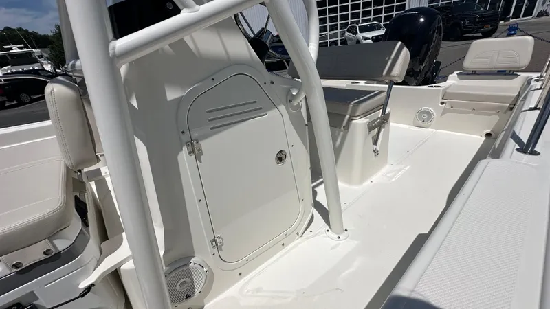 Slide: The Image of 2025 Boston Whaler 190 Montauk boat interior, featuring seating and storage compartments. - 17