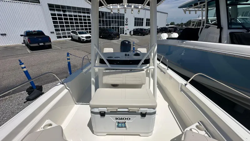 Slide: The Image of 2025 Boston Whaler 190 Montauk boat interior with seating and Igloo cooler. - 21