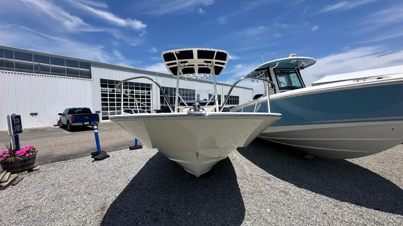 Slide: The Image of 2025 Boston Whaler 190 Montauk boat displayed outdoors under a clear blue sky. - 27