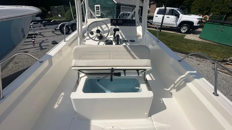 Slide: The Image of 2025 Boston Whaler 190 Montauk interior with steering console and seating. - 9