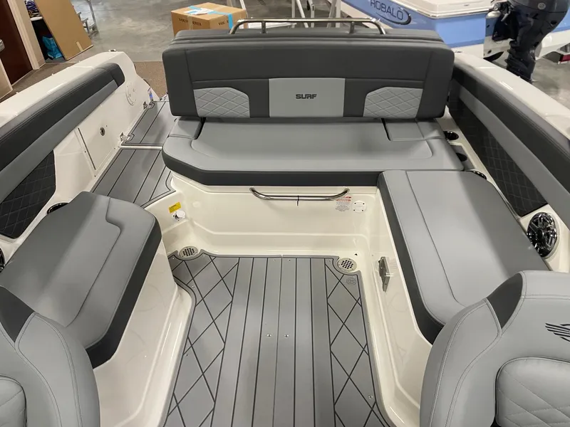 Slide: The Image of 2025 Chaparral 26 Surf boat interior with gray seating and modern design. - 5