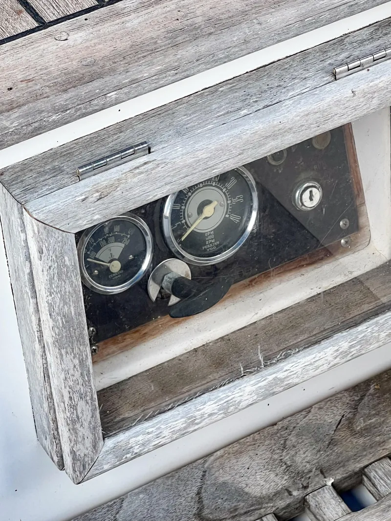 Slide: The Image of Vintage Tayana Vancouver 42 boat dashboard with gauges, 1986 model, weathered wood frame. - 16