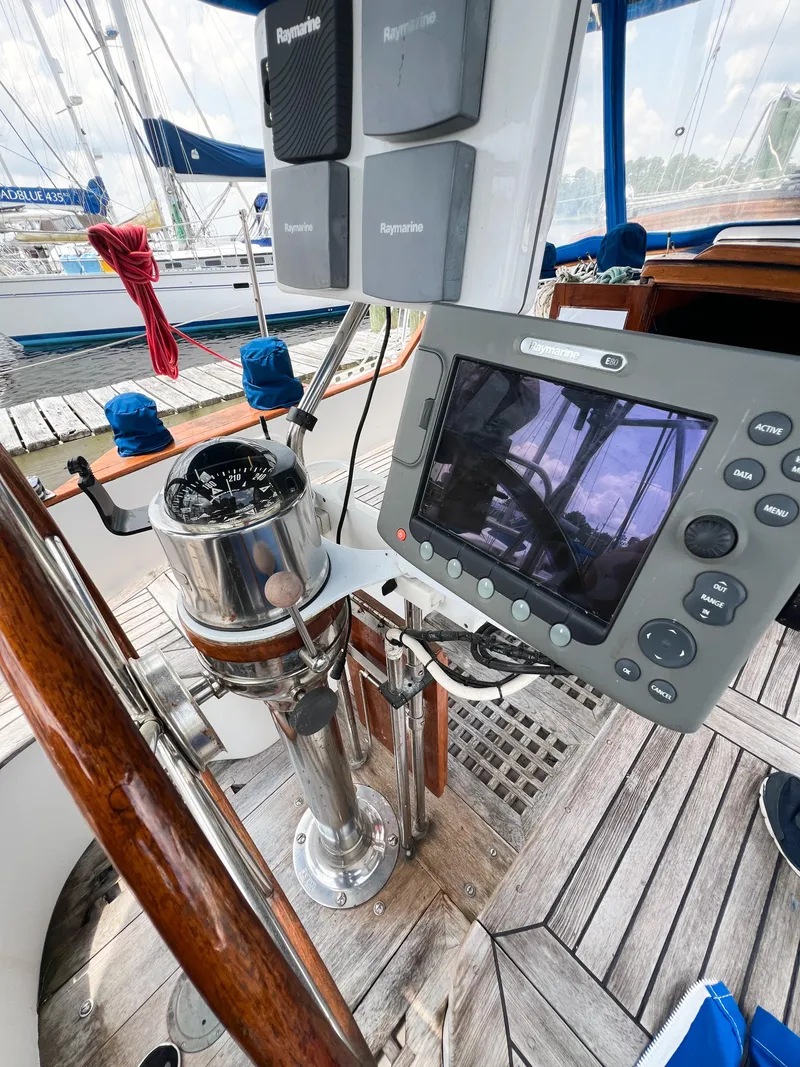 Slide: The Image of Cockpit of 1986 Tayana Vancouver 42 sailboat with navigation equipment and compass. - 17