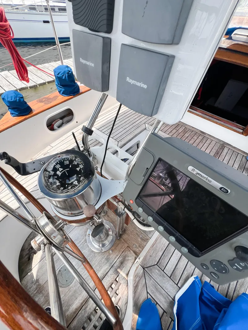 Slide: The Image of Cockpit of 1986 Tayana Vancouver 42 sailboat with navigation instruments and compass. - 18