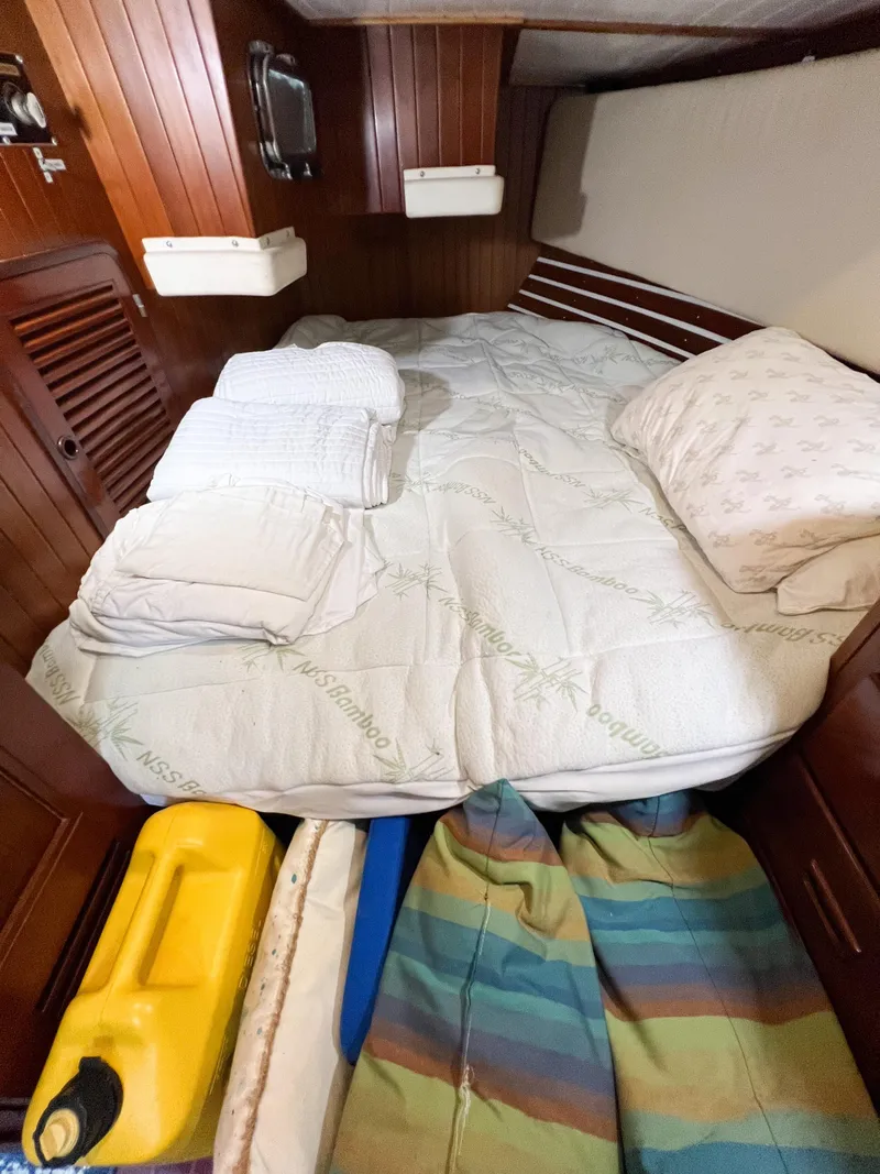 Slide: The Image of Cozy cabin interior of 1986 Tayana Vancouver 42 sailboat with bed and storage. - 20