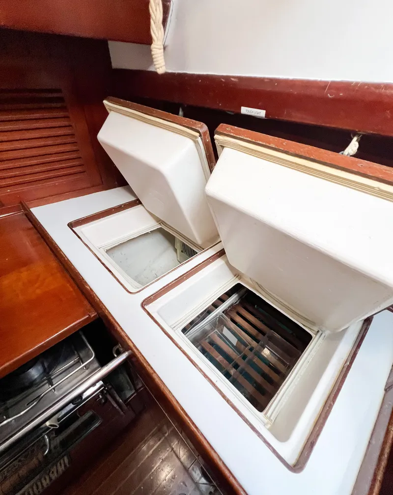 Slide: The Image of Interior view of 1986 Tayana Vancouver 42 yacht with open storage compartments. - 27