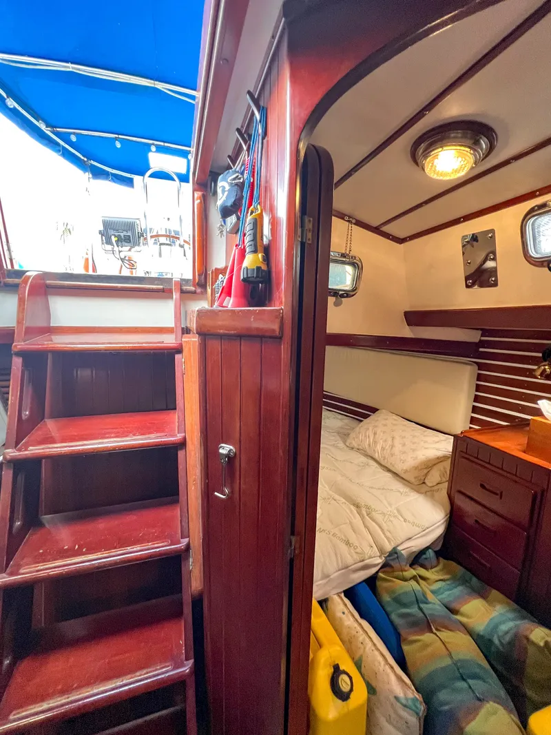 Slide: The Image of Interior of 1986 Tayana Vancouver 42 sailboat with wooden stairs and cozy cabin. - 29