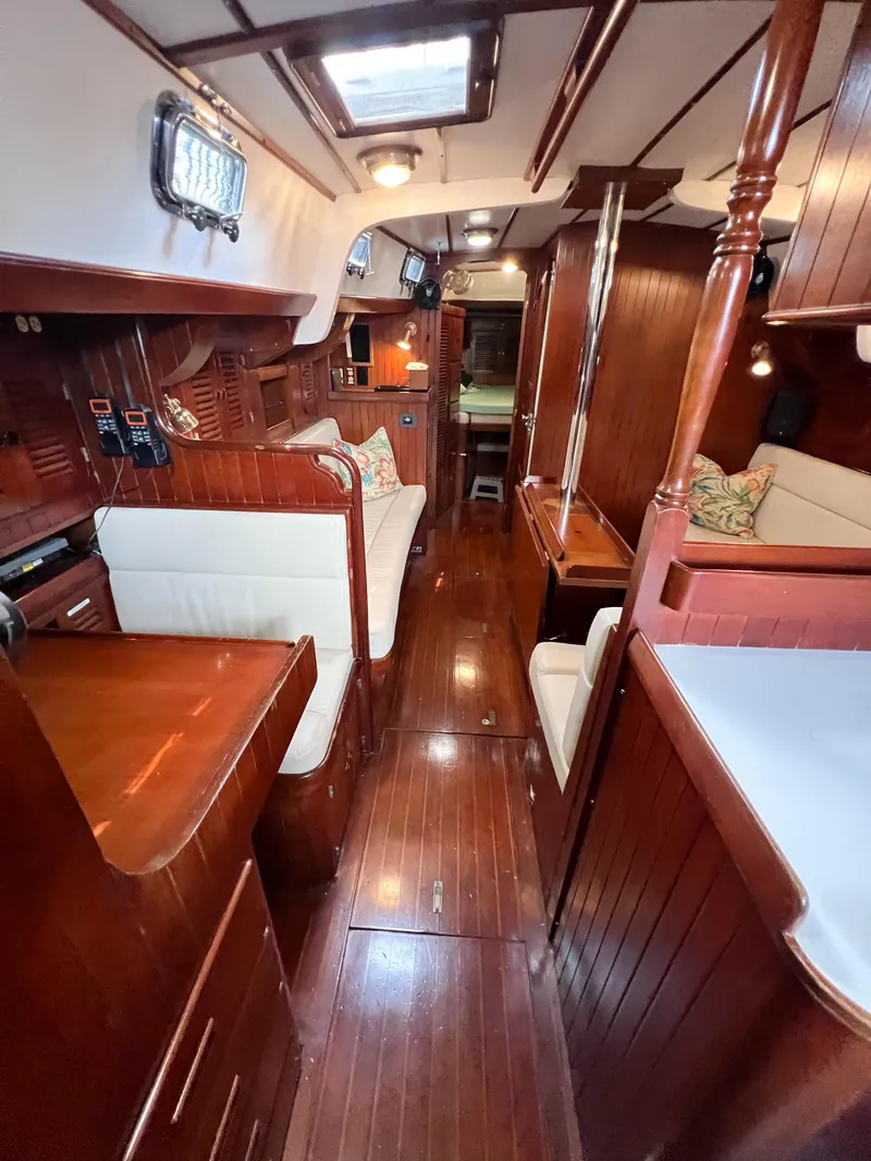 Slide: The Image of Interior of 1986 Tayana Vancouver 42 yacht with polished wood and cozy seating. - 35