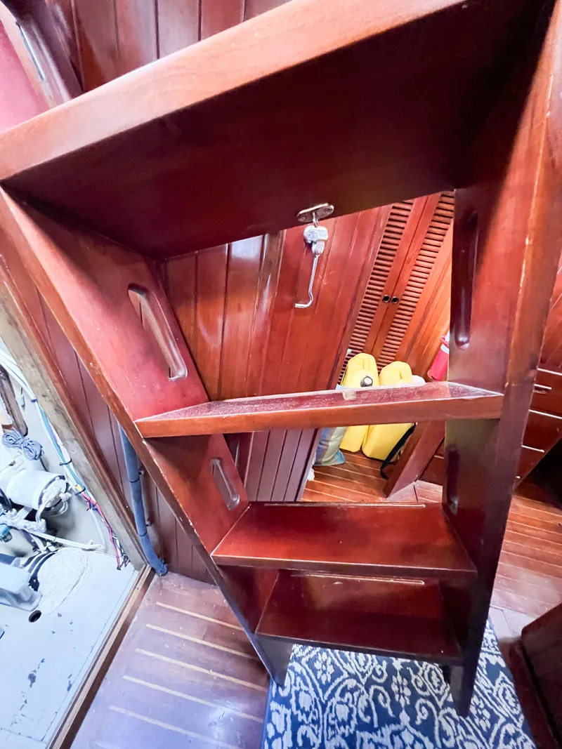 Slide: The Image of Wooden interior stairs on 1986 Tayana Vancouver 42 sailboat, featuring rich mahogany finish. - 39