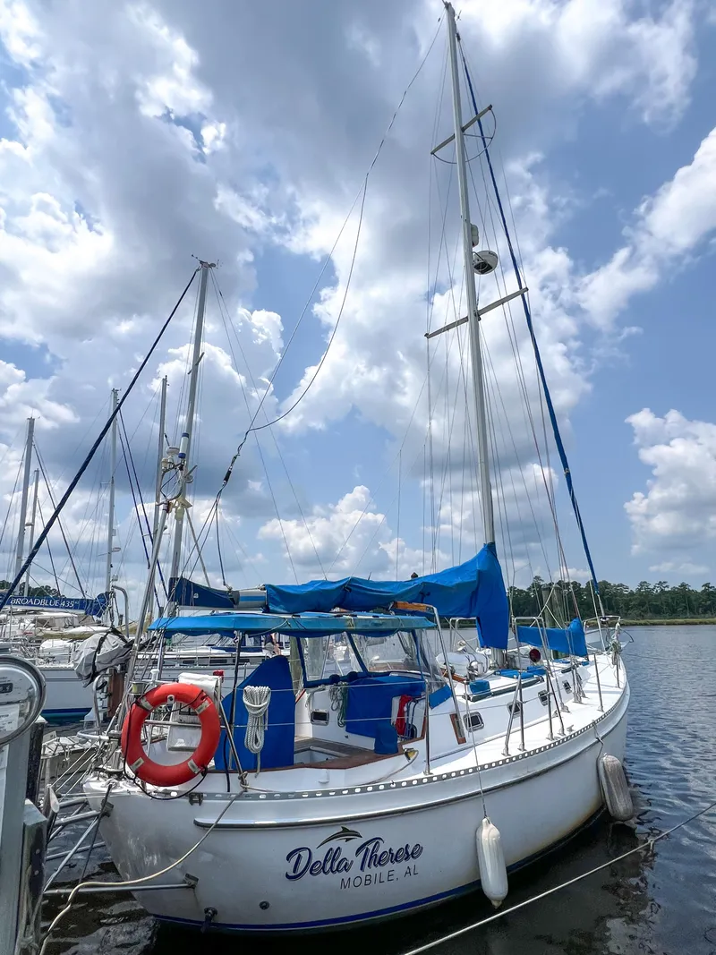 Slide: The Image of 1986 Tayana Vancouver 42 sailboat docked under a cloudy sky. - 4