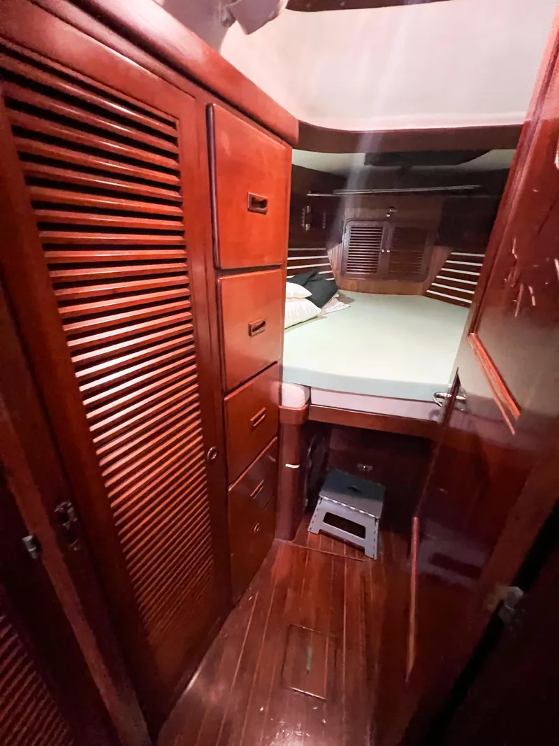 Slide: The Image of Cozy cabin interior of 1986 Tayana Vancouver 42 sailboat with wooden furnishings. - 41