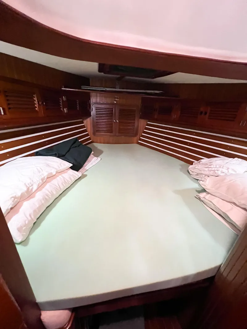 Slide: The Image of Cozy cabin interior of 1986 Tayana Vancouver 42 sailboat with wooden finish. - 42