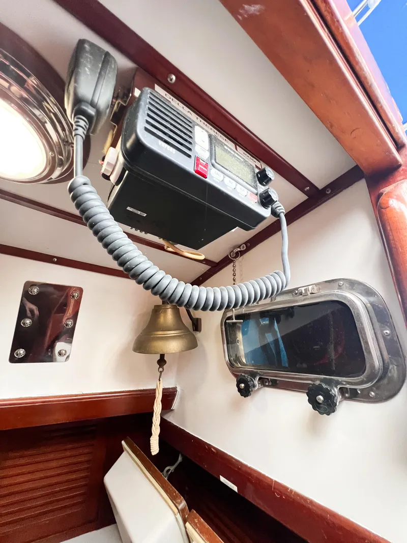 Slide: The Image of Interior of 1986 Tayana Vancouver 42 yacht with radio, bell, and porthole. - 44