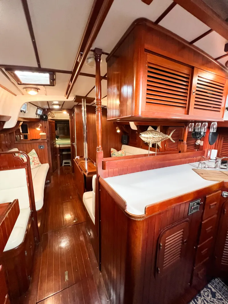 Slide: The Image of Interior of 1986 Tayana Vancouver 42 sailboat with polished wood and cozy seating. - 47