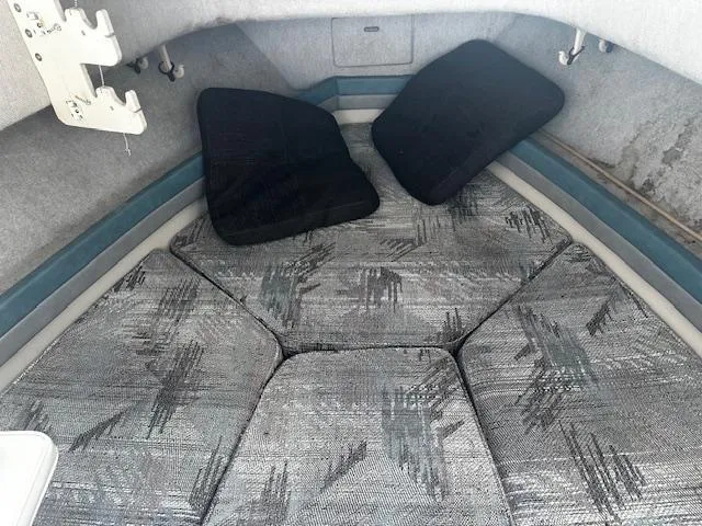 Slide: The Image of 1993 Grady-White Sailfish 252 cabin interior with cushions and patterned upholstery. - 13
