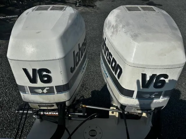 Slide: The Image of Twin Johnson V6 outboard engines on a 1993 Grady-White Sailfish 252 boat. - 18