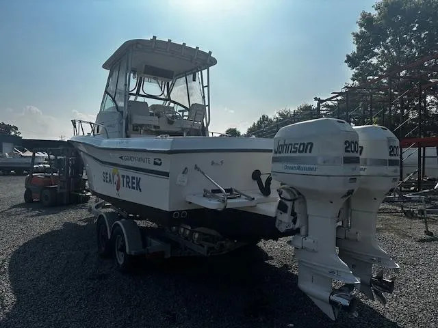 Slide: The Image of 1993 Grady-White Sailfish 252 boat with twin Johnson 200 engines on a trailer. - 2