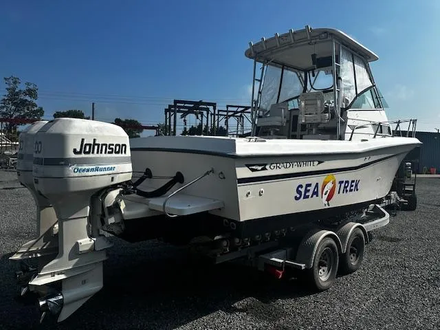 Slide: The Image of 1993 Grady-White Sailfish 252 boat with Johnson OceanRunner engine on trailer. - 3