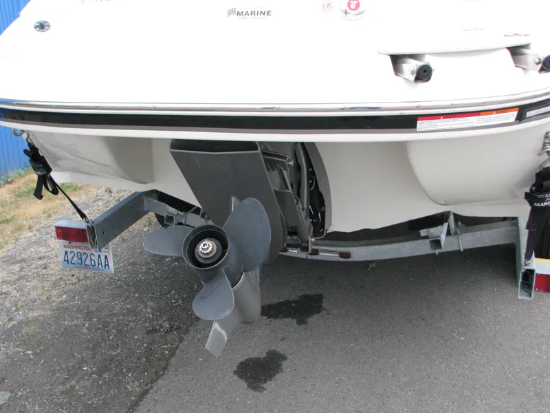 Slide: The Image of Rear view of a 2017 Stingray 215 CR boat with visible propeller and trailer. - 3