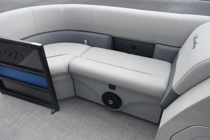 Slide: The Image of 2026 Bentley Pontoons Legacy 223 Swingback interior with gray seating and speaker. - 11