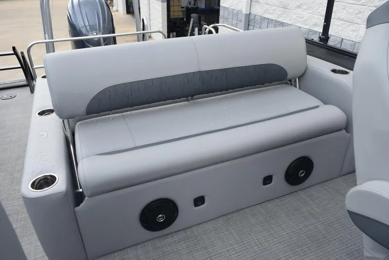Slide: The Image of 2026 Bentley Pontoons Legacy 223 Swingback with gray seating and cup holders. - 14