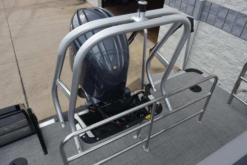 Slide: The Image of 2026 Bentley Pontoons Legacy 223 Swingback with outboard motor and safety railing. - 15