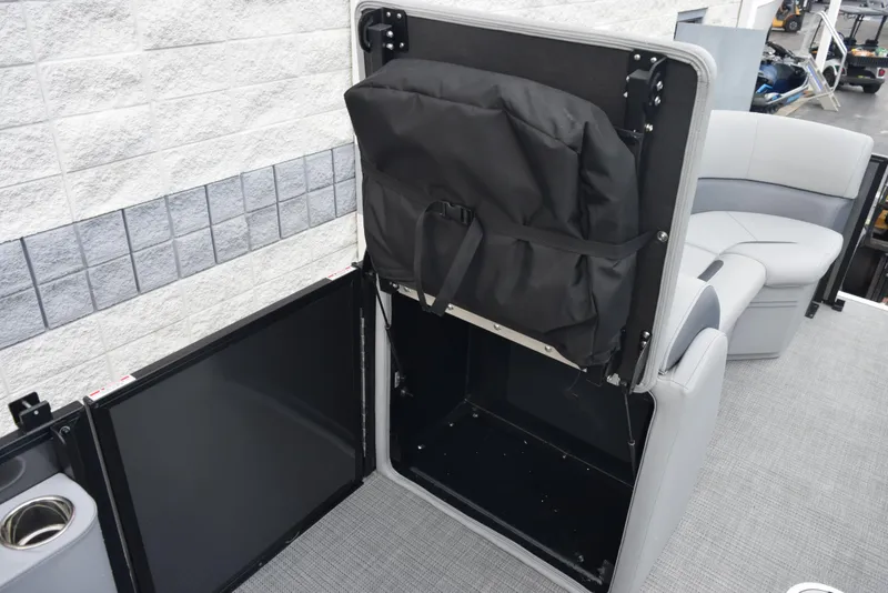 Slide: The Image of 2026 Bentley Pontoons Legacy 223 Swingback interior storage compartment with seating and cup holder. - 16