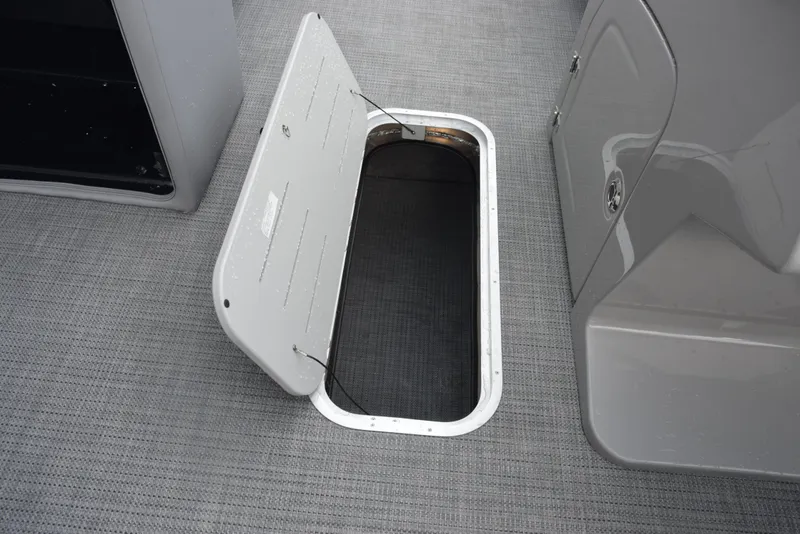Slide: The Image of Open storage compartment on 2026 Bentley Pontoons Legacy 223 Swingback boat. - 17