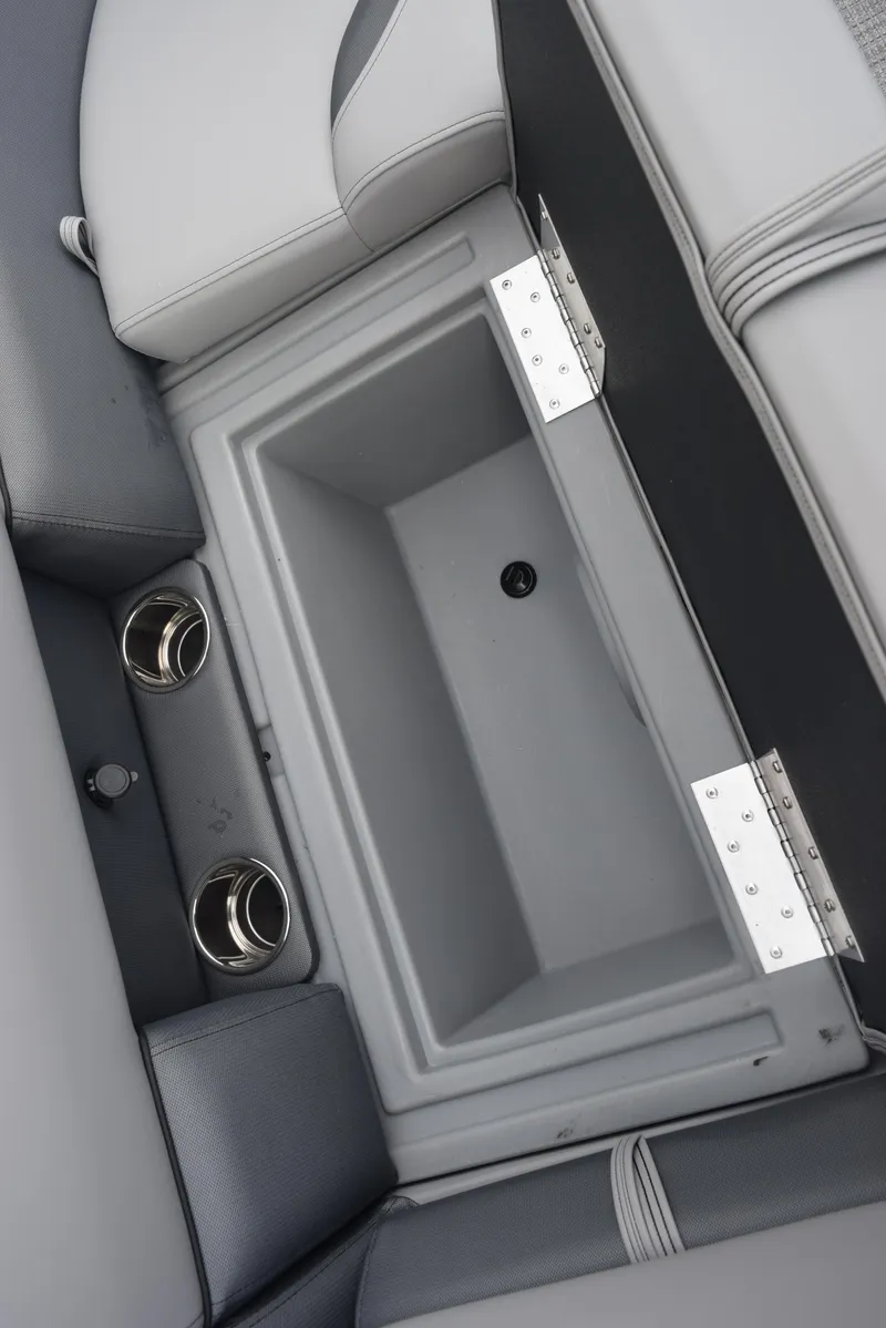 Slide: The Image of 2026 Bentley Pontoons Legacy 223 Swingback storage compartment with cup holders. - 19