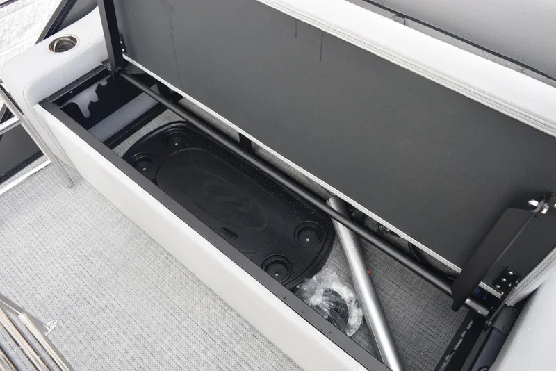 Slide: The Image of Open storage compartment in 2026 Bentley Pontoons Legacy 223 Swingback boat. - 20