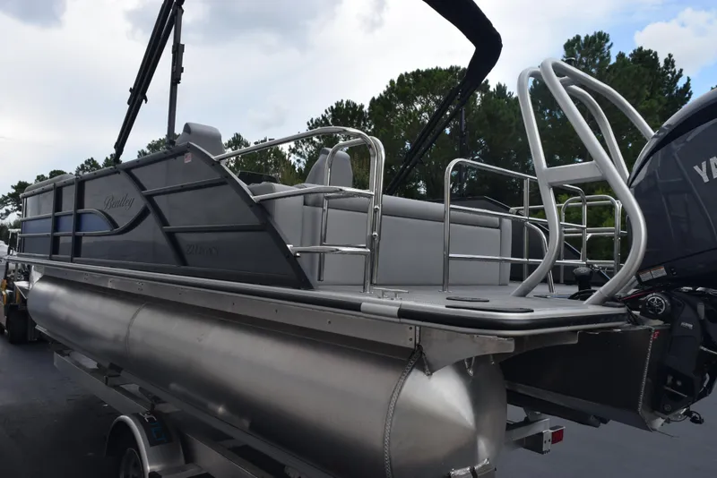 Slide: The Image of 2026 Bentley Pontoons Legacy 223 Swingback, sleek design, silver finish, outdoor setting. - 6