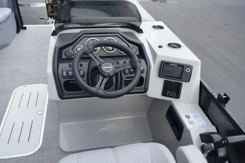 Slide: The Image of 2026 Bentley Pontoons Legacy 223 Swingback dashboard with steering wheel and controls. - 8