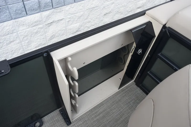 Slide: The Image of 2026 Bentley Pontoons Fish 243 Fish n' Cruise storage compartment detail. - 13