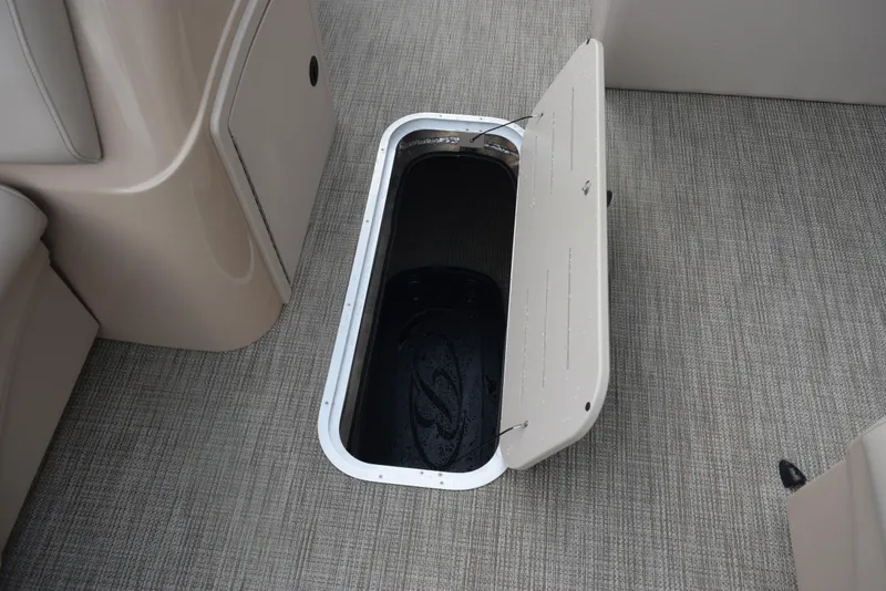Slide: The Image of Open storage compartment on 2026 Bentley Pontoons Fish 243 Fish n' Cruise boat. - 15