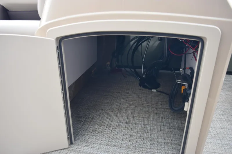 Slide: The Image of Open storage compartment in 2026 Bentley Pontoons Fish 243 Fish n' Cruise boat. - 16