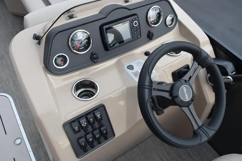 Slide: The Image of 2026 Bentley Pontoons Fish 243 Fish n' Cruise dashboard with steering wheel and gauges. - 17