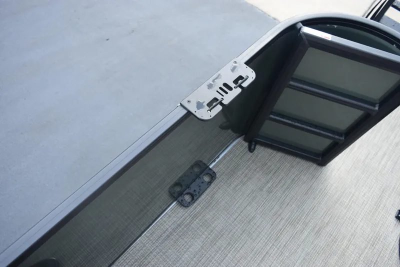 Slide: The Image of 2026 Bentley Pontoons Fish 243 Fish n' Cruise deck detail with ladder attachment. - 19