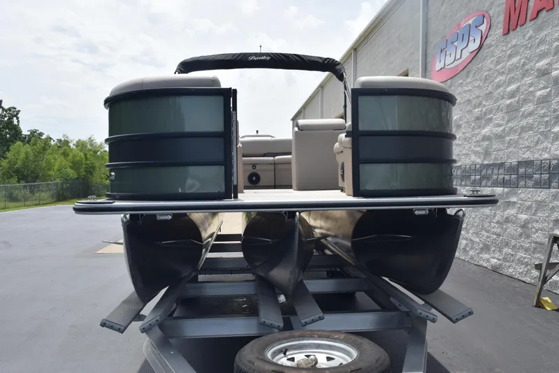 Slide: The Image of 2026 Bentley Pontoons Fish 243 Fish n' Cruise on trailer, outdoor showroom display. - 2