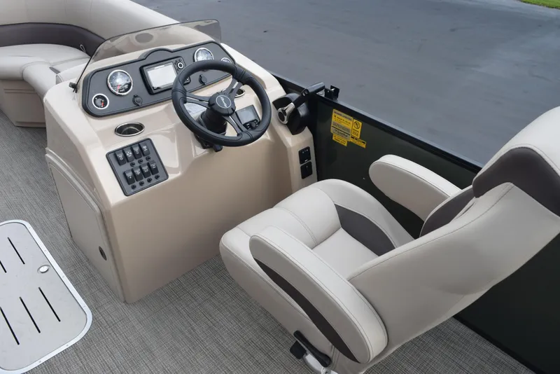 Slide: The Image of 2026 Bentley Pontoons Fish 243 Fish n' Cruise helm with steering wheel and control panel. - 9
