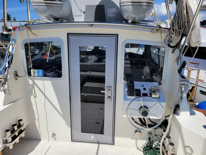 Slide: The Image of SeaSport 2400 XL Limited boat cockpit with steering wheel and equipment, year 2000 model. - 12