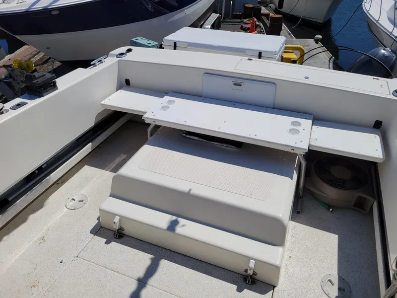 Slide: The Image of 2000 SeaSport 2400 XL Limited boat interior with seating and storage compartments. - 14