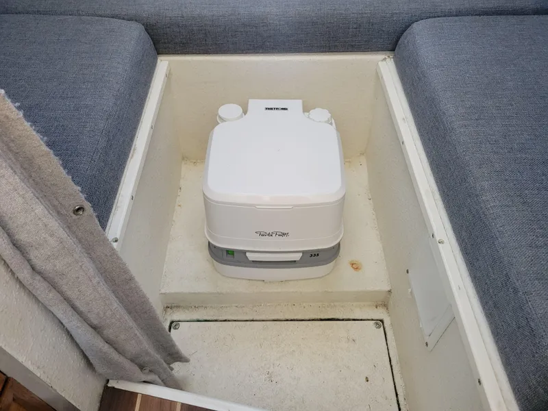 Slide: The Image of Portable toilet in a 2000 SeaSport 2400 XL Limited boat interior. - 23