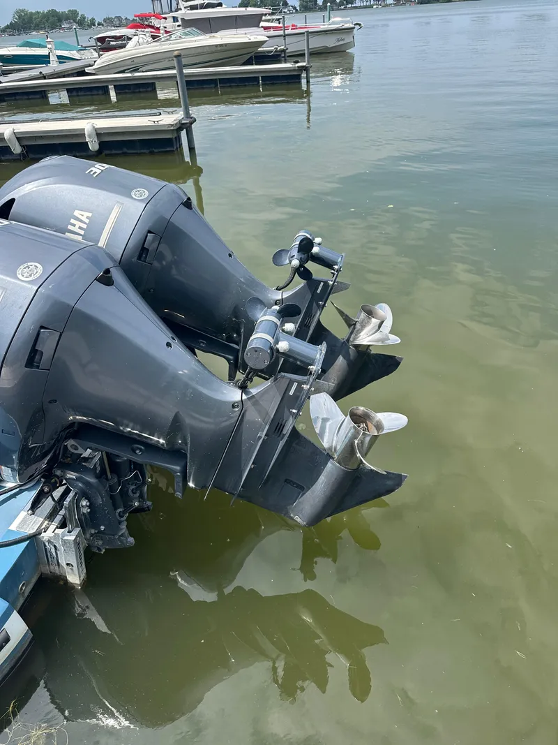 Slide: The Image of Twin Yamaha outboard motors on a 2018 True North 34OE boat at a marina. - 17