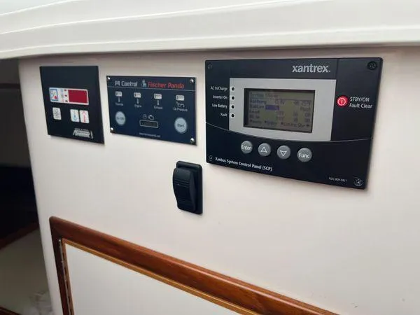 Slide: The Image of Control panels on a 2018 True North 34OE boat, featuring Xantrex system. - 33