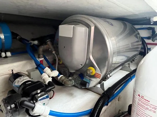 Slide: The Image of Water heater system in a 2018 True North 34OE boat, featuring pipes and connections. - 39