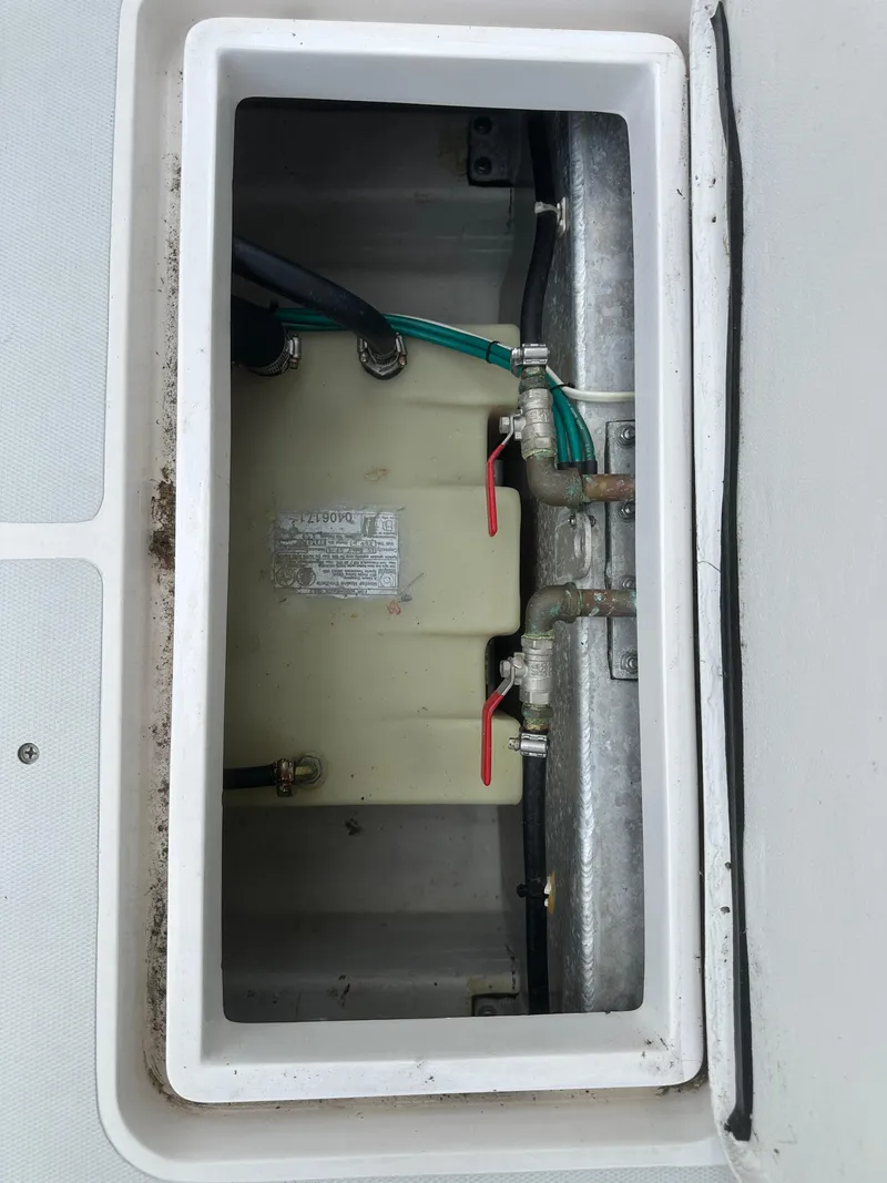 Slide: The Image of Boat compartment with plumbing and wiring, True North 34OE, 2018 model. - 46