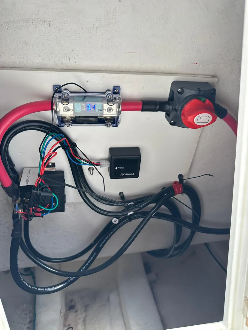 Slide: The Image of Electrical wiring setup in a 2018 True North 34OE boat, featuring cables and switches. - 47