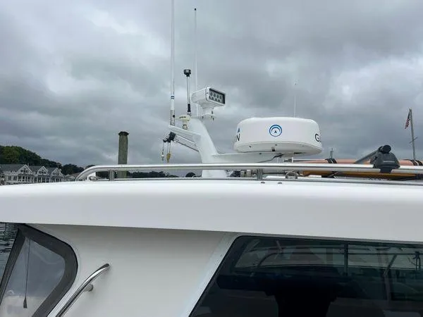 Slide: The Image of 2018 True North 34OE boat with radar and navigation equipment under cloudy skies. - 7